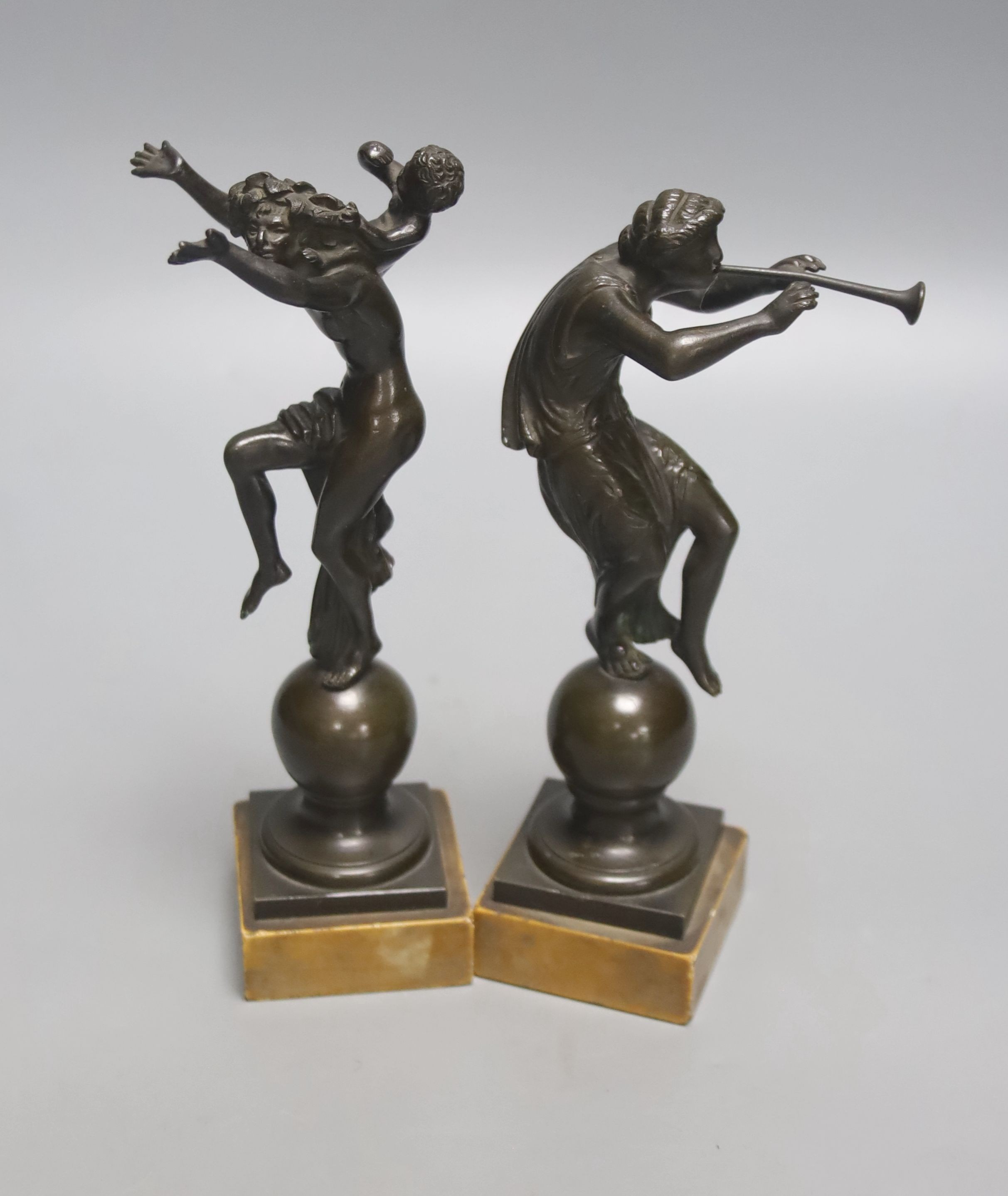 After the Antique. A pair of Grand Tour bronze classical figures, unsigned, on marble plinths, height 19cm